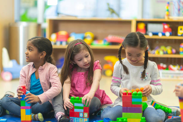 istock Three young girls playing together 1082766898