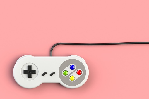 Video game console GamePad. Gaming concept. Top view retro joystick isolated on pink background, 3D rendering
