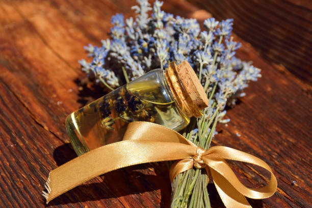 istock lavender oil and lavender flowers 1082784424
