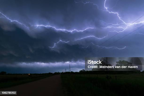 A Lightningbolt Creeps Through The Clouds Over Northeastern Nebraska Stock Photo - Download Image Now