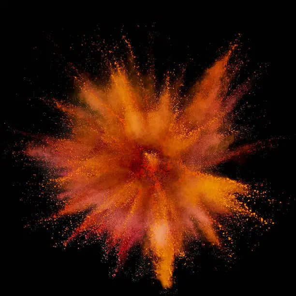 Photo of Colored powder explosion. Abstract closeup dust on backdrop. Colorful explode. Paint holi