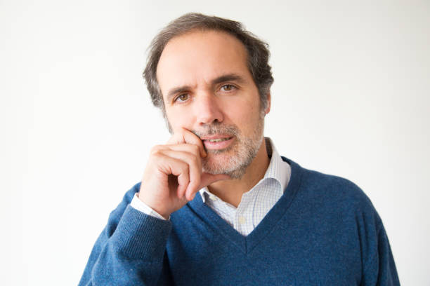istock Caucasian thoughtful man in bad mood looking at camera 1082789550