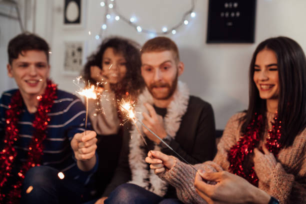istock Happy people holding sparklers 1082789554