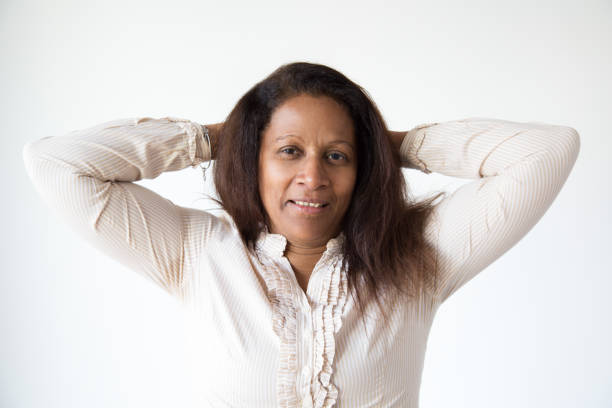 istock Indian brunette woman relaxing with hands behind head 1082789608