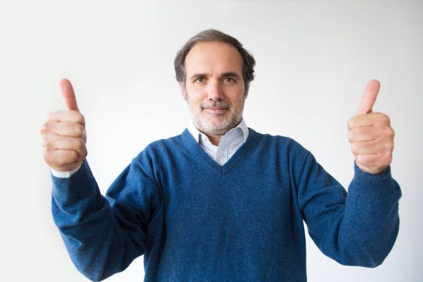 istock Smiling bearded mature man showing thumbs up 1082789692