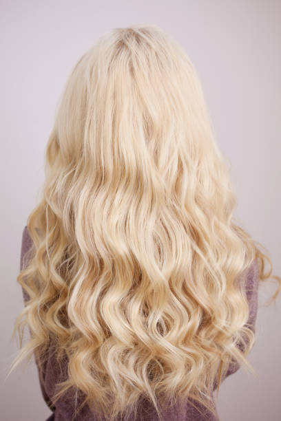 back of short hair blond wig isolated on white background