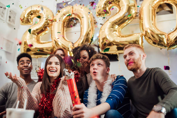 istock Happy teenagers with confetti 1082790728