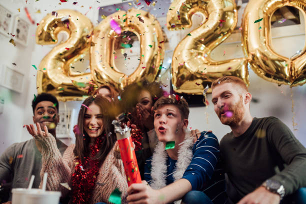 istock Group of friends with confetti 1082790742