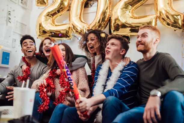 istock Happy people holding confetti 1082790910