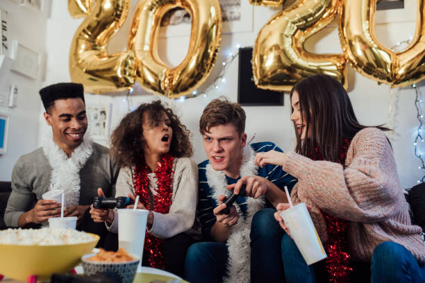 istock Boys playing video games with girls 1082791526