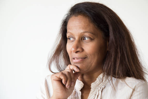 istock Sly mix raced woman thinking over idea 1082792390