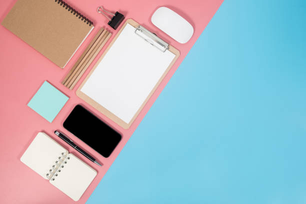 istock Smartphone and office accessories on colorful background with copy space. Flat lay modern and minimal style. 1082797010