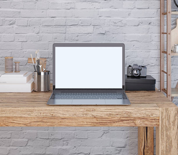 istock mockup poster laptop screen on the desktop. 1082812374