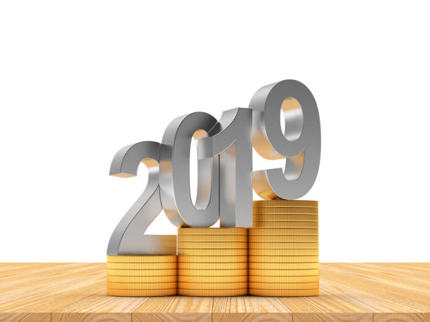 istock Silver 2019 on golden coins on wooden floor on white 1082820038