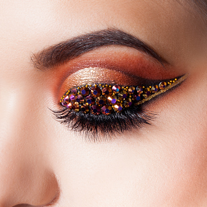 Amazing Bright Eye Makeup With A Arrow With Rhinestones Brown And Gold  Tones Colored Eyeshadow Stock Photo - Download Image Now - iStock