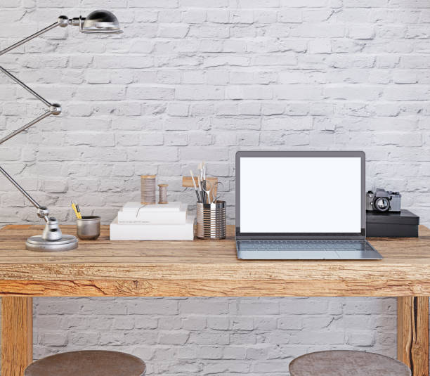 istock mockup poster laptop screen on the desktop. 1082826202