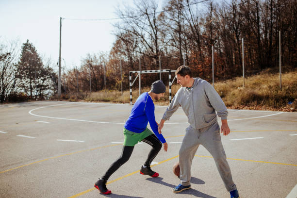 istock Playing one-on-one basketball 1082826216