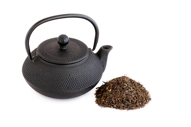istock tea of iron, stacked dried tea leaves isolated on white background 1082830472