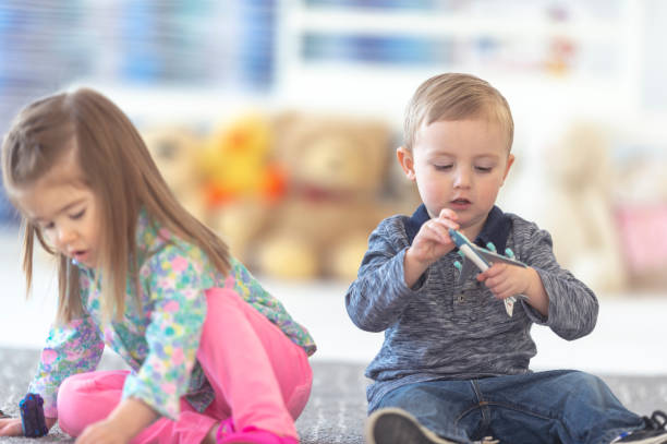 istock Adorable preschoolers playing 1082830802