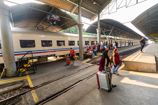 Surabaya, Indonesia - August 14, 2018:   view showing passengers arriving in the Surabaya train station