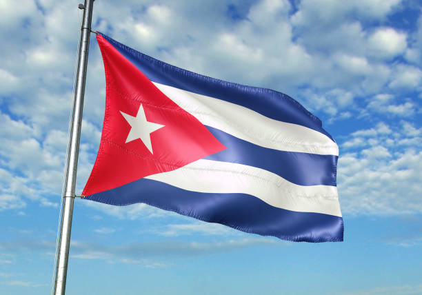 istock Cuba flag waving cloudy sky background 1082842684