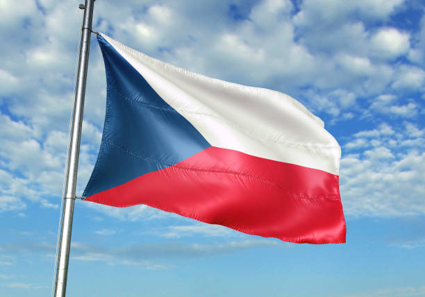 istock Czech Republic flag waving cloudy sky background 1082842690