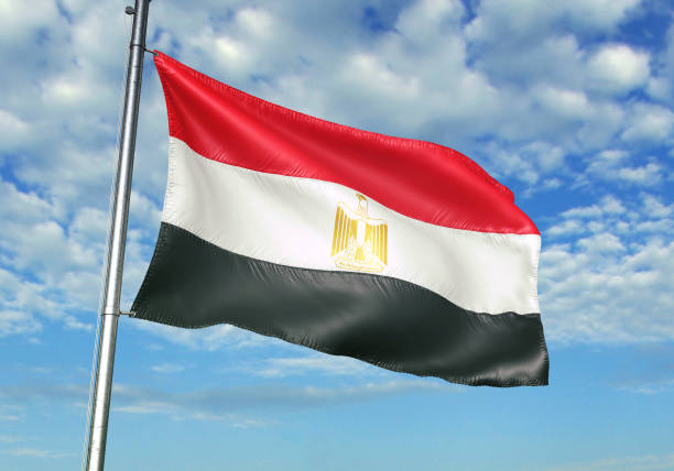 istock Egypt flag waving cloudy sky background 1082842718