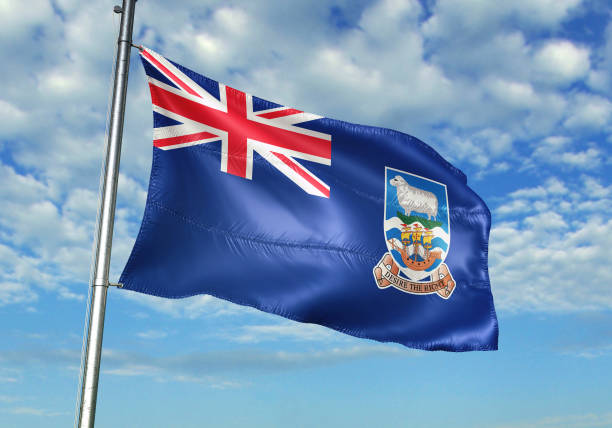 istock Falkland Islands flag waving cloudy sky background 1082842862