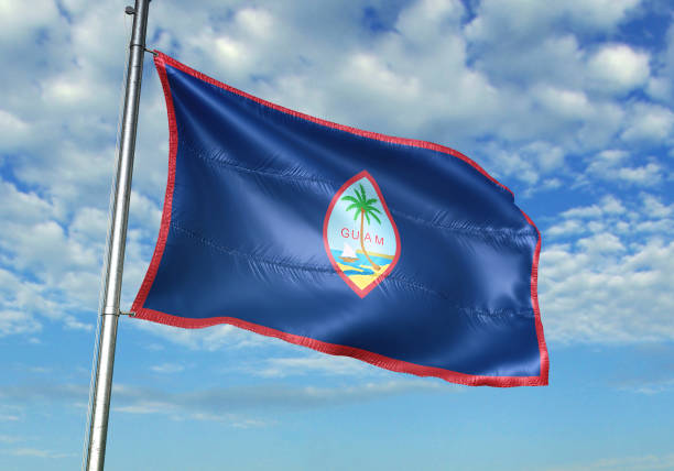 istock Guam flag waving cloudy sky background 1082843046