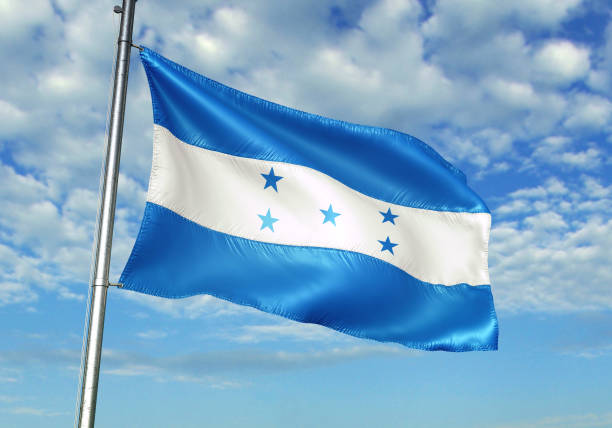 istock Honduras flag waving cloudy sky background 1082843112