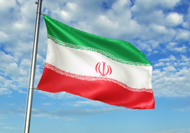 istock Iran flag waving cloudy sky background 1082843854
