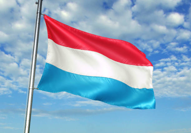 Luxembourg flag on flagpole waving cloudy sky background realistic 3d illustration