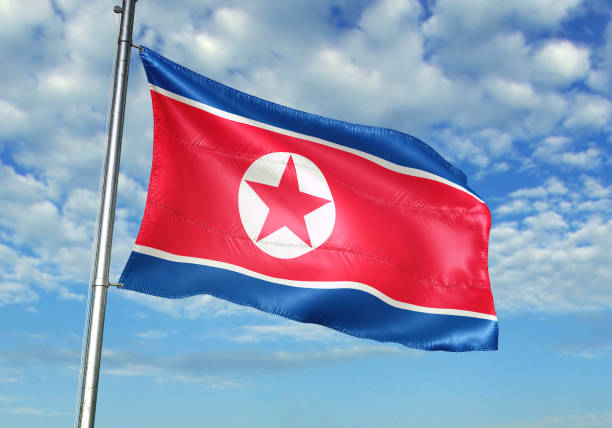 istock North Korea flag waving cloudy sky background 1082844304
