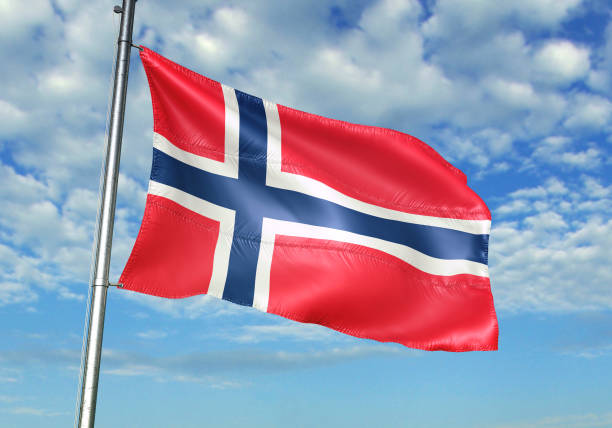 istock Norway flag waving cloudy sky background 1082844312
