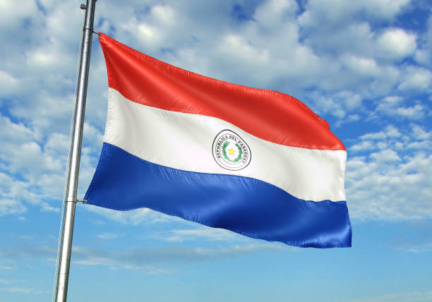 istock Paraguay flag waving cloudy sky background 1082844390