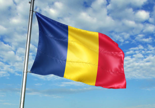 istock Romania flag waving cloudy sky background 1082845466