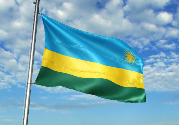istock Rwanda flag waving cloudy sky background 1082845490