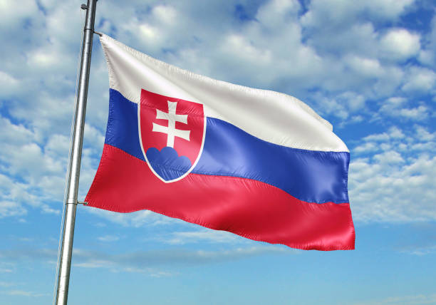 istock Slovakia flag waving cloudy sky background 1082845658