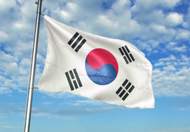 istock South Korea flag waving cloudy sky background 1082847666