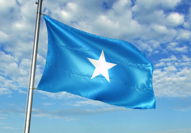 istock Somalia flag waving cloudy sky background 1082847712