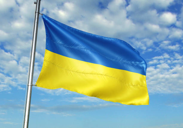 istock Ukraine flag waving cloudy sky background 1082847814