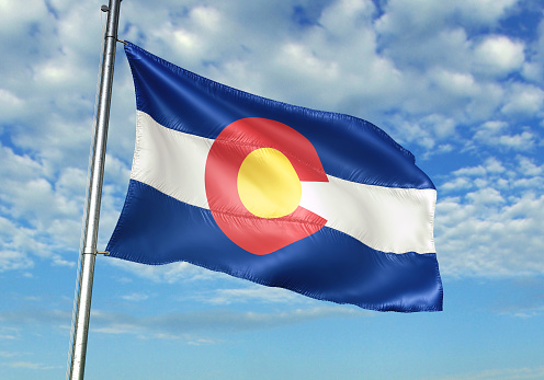 Colorado state of United States flag on flagpole waving cloudy sky background realistic 3d illustration