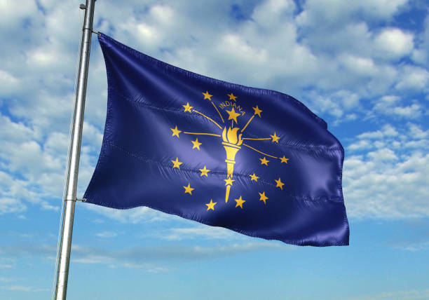 Indiana state of United States flag waving cloudy sky background Indiana state of United States flag on flagpole waving cloudy sky background realistic 3d illustration seal of the state of indiana stock pictures, royalty-free photos & images