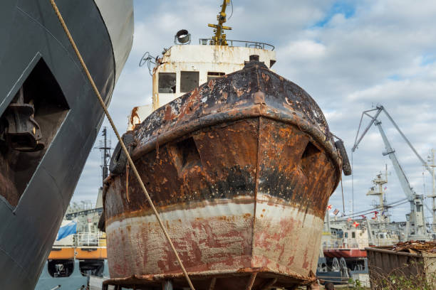 istock Rusty decommissioned marine ship that was left on the shore. 1082860564