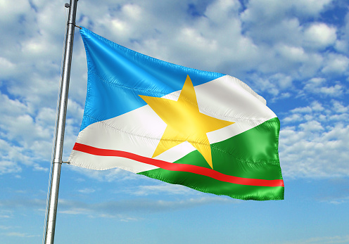 The national flag of Ghana with fabric texture waving in the wind on a blue sky. 3D Illustration