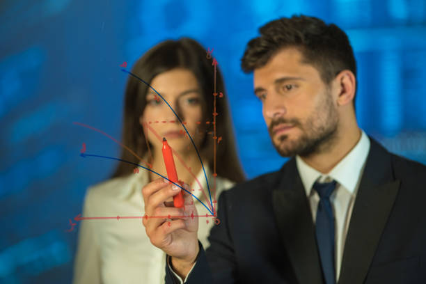 istock The man and woman drawing on the virtual board 1082867170