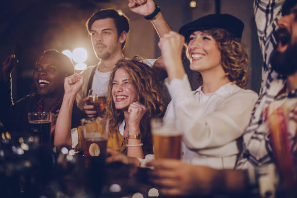 istock Group of happy friends at the pub 1082869930