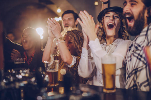 happy friends at the bar - beer pub women pint glass imagens e fotografias de stock