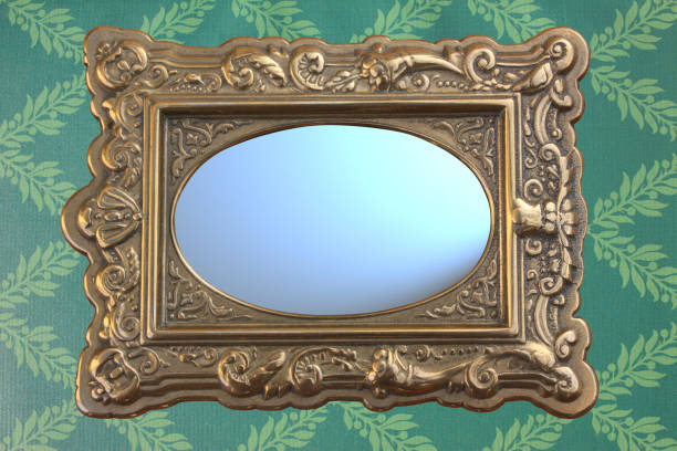 istock Retro style mirror set on wall covered with style wallpaper 1082871742