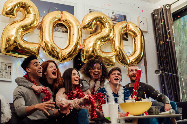 istock Smiling friends holding confetti box 1082877528
